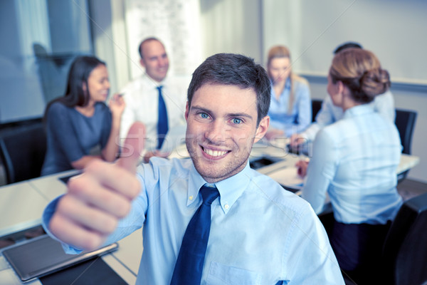 Groupe souriant gens d'affaires réunion bureau gens d'affaires [[stock_photo]] © dolgachov