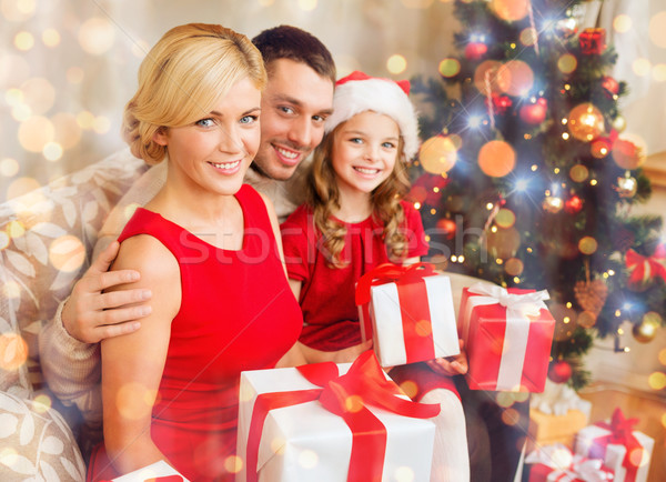 smiling family holding many gift boxes Stock photo © dolgachov