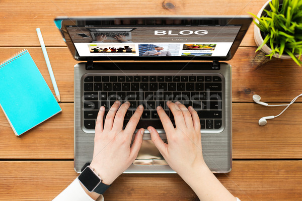 close up of woman blogging on laptop Stock photo © dolgachov