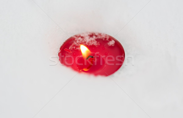 burning christmas candle on snow in winter Stock photo © dolgachov