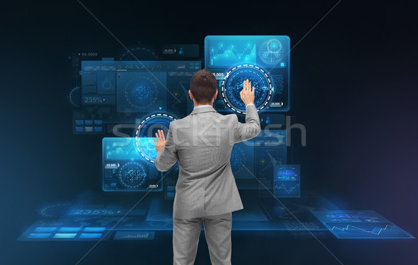 businessman working with virtual screens Stock photo © dolgachov