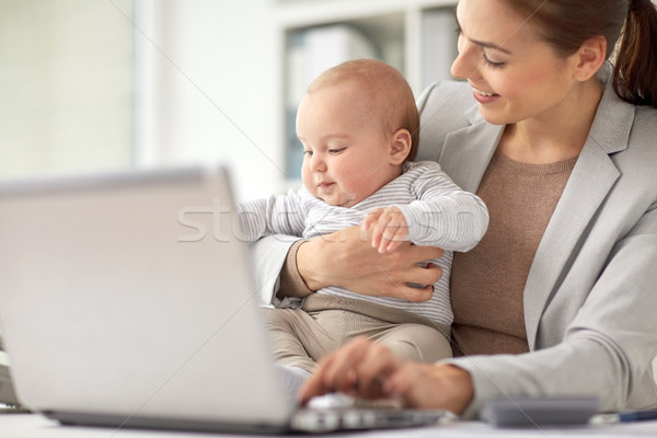 happy businesswoman with baby and laptop at office Stock photo © dolgachov