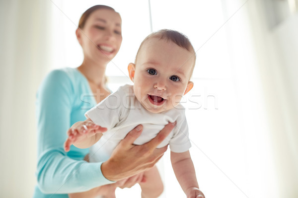 happy young mother with little baby at home Stock photo © dolgachov