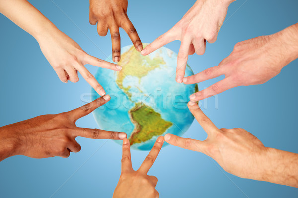 group of international people showing peace sign Stock photo © dolgachov