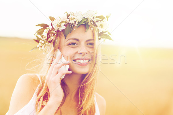 happy young woman calling on smartphone at country Stock photo © dolgachov