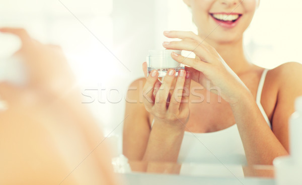 Boldog női arc krém fürdőszoba szépség bőrápolás Stock fotó © dolgachov
