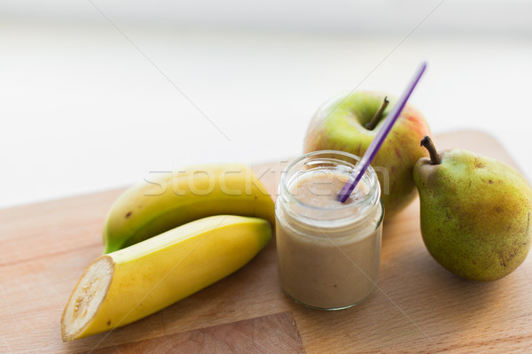 jar with fruit puree or baby food Stock photo © dolgachov