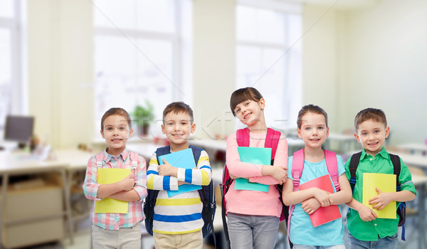 happy children with school bags and notebooks Stock photo © dolgachov