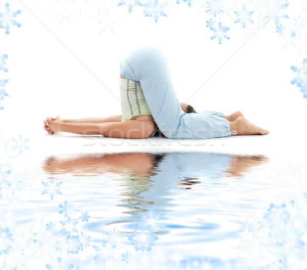 halasana plow pose on white sand Stock photo © dolgachov