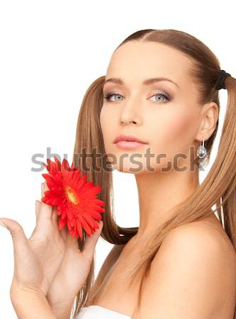 Stock photo: lovely woman with red flowers