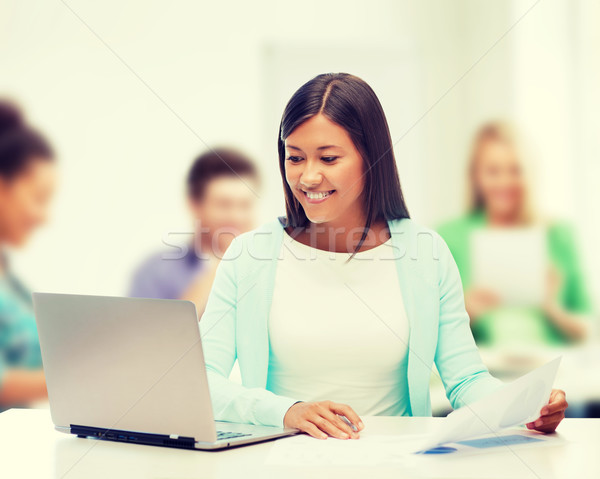 Stock photo: asian businesswoman with laptop and documents