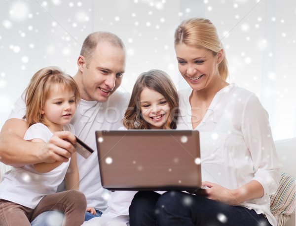 happy family with laptop computer and credit card Stock photo © dolgachov