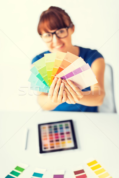 woman showing pantone color samples Stock photo © dolgachov