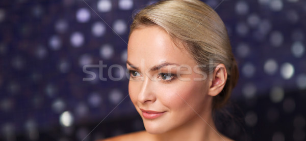 close up of young woman sitting in bath towel Stock photo © dolgachov