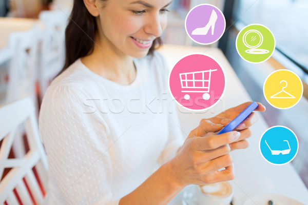 smiling woman with smartphone shopping online Stock photo © dolgachov