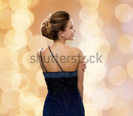 Femme diamant boucles d'oreilles belle femme robe de soirée Photo stock © dolgachov