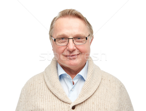 smiling senior man in cardigan Stock photo © dolgachov