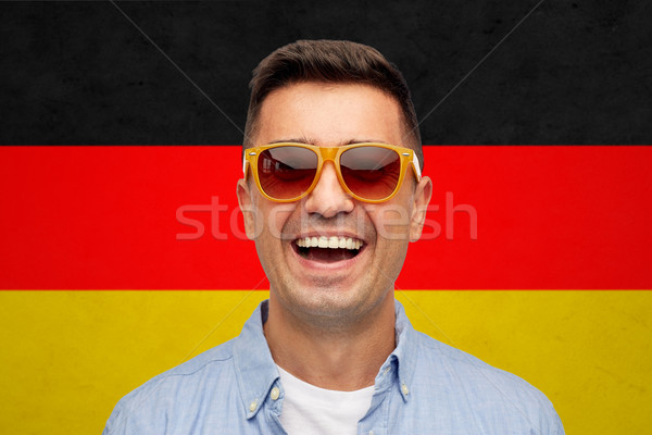 Gezicht glimlachend man zonnebril vlag zomer Stockfoto © dolgachov