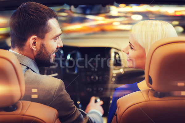 happy couple driving in car over night city  Stock photo © dolgachov