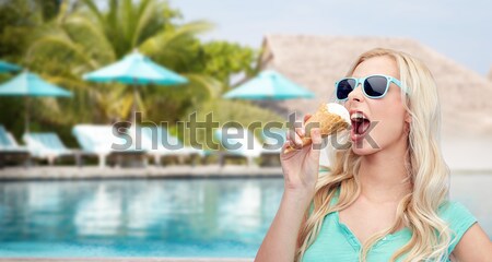 smiling young woman with sunglasses on beach Stock photo © dolgachov