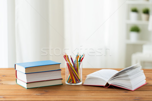 close up of crayons or color pencils and books Stock photo © dolgachov