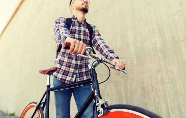 Homme fixé engins vélo sac à dos [[stock_photo]] © dolgachov