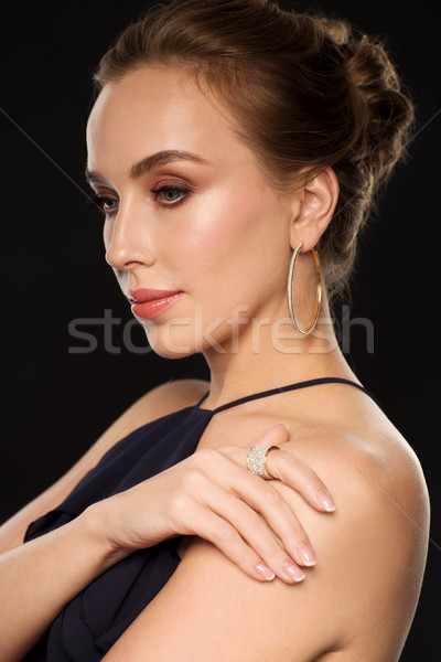 beautiful woman in black wearing diamond jewelry Stock photo © dolgachov