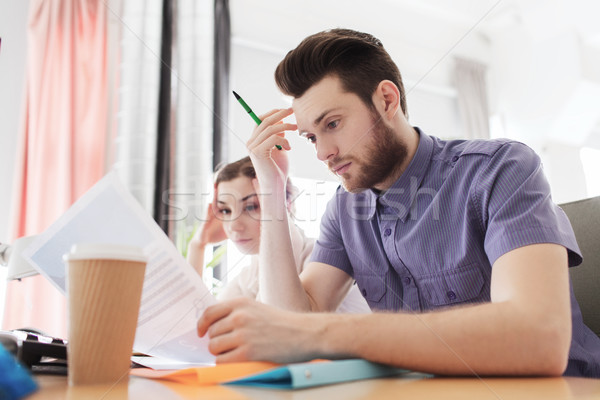 creative team with computer and papers in office Stock photo © dolgachov