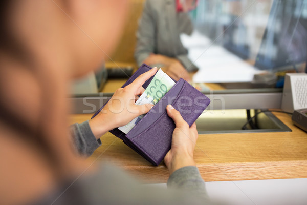 hands with money at bank or currency exchanger Stock photo © dolgachov