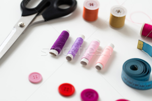 scissors, sewing buttons, threads and tape measure Stock photo © dolgachov
