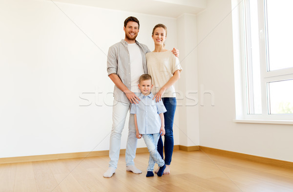 happy family with child moving to new home Stock photo © dolgachov