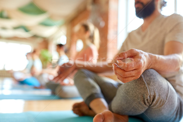 group of people making yoga exercises at studio Stock photo © dolgachov