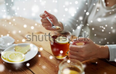 close up of happy woman with cup of cocoa at home Stock photo © dolgachov
