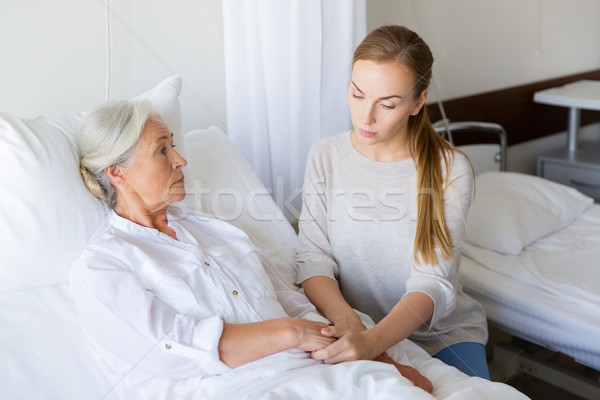 daughter visiting her senior mother at hospital Stock photo © dolgachov