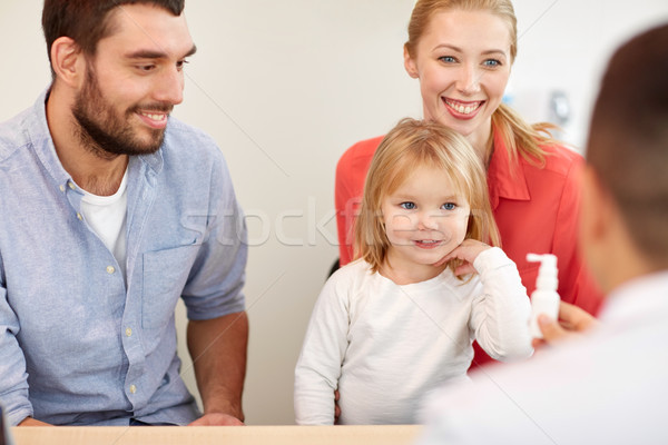 happy family with daughter and doctor at clinic Stock photo © dolgachov