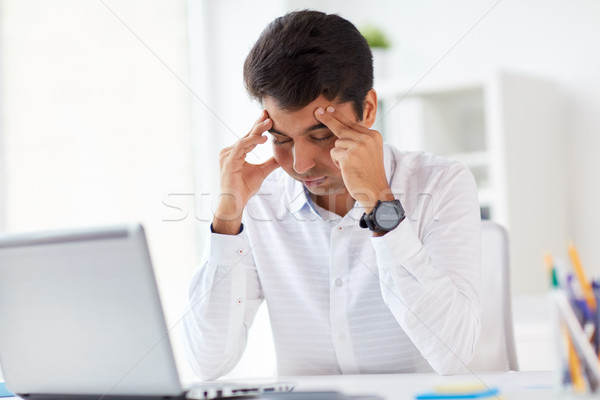 stressed businessman with laptop at office Stock photo © dolgachov