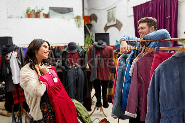 couple choosing clothes at vintage clothing store Stock photo © dolgachov
