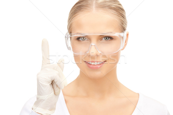 woman in protective glasses and gloves Stock photo © dolgachov