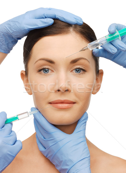 woman face and beautician hands Stock photo © dolgachov