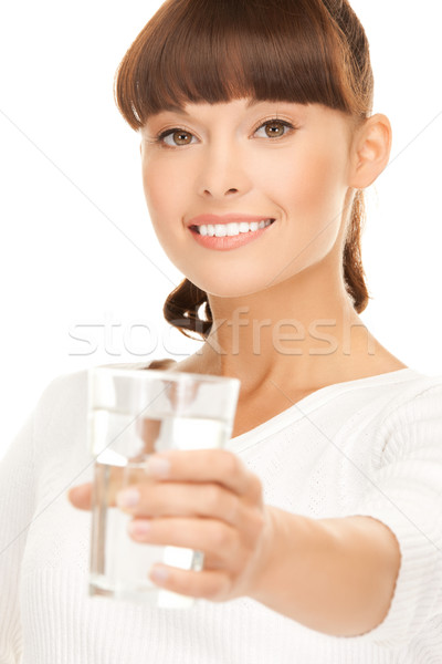 Genç gülümseyen kadın cam su teklif Stok fotoğraf © dolgachov