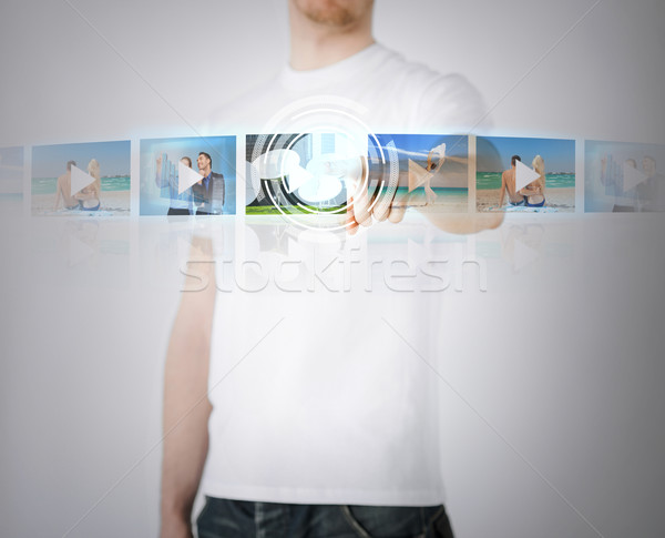 man with virtual screen Stock photo © dolgachov