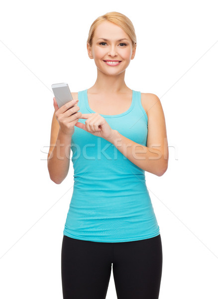 Stock photo: sporty woman with smartphone