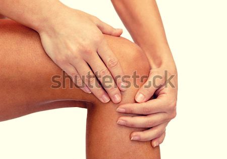 close up of female hands holding knee Stock photo © dolgachov