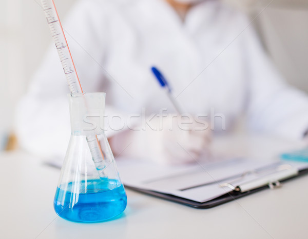 close up of scientist making test in laboratory Stock photo © dolgachov