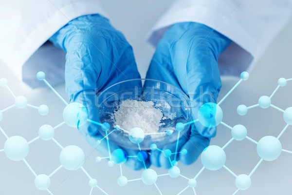 close up of scientist holding petri dish in lab Stock photo © dolgachov