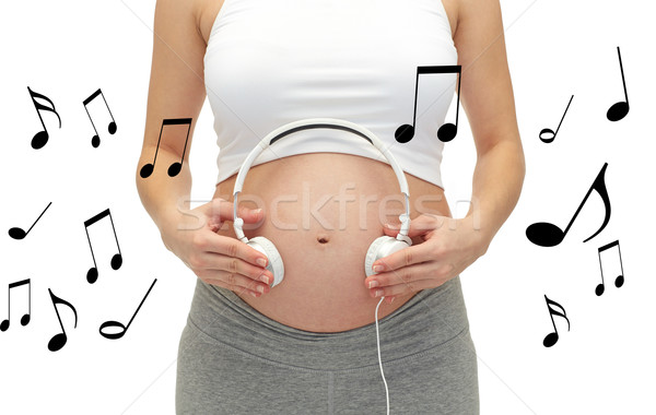 Közelkép terhes nő fejhallgató pocak terhesség emberek Stock fotó © dolgachov