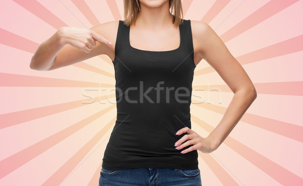 close up of woman in blank black tank top Stock photo © dolgachov