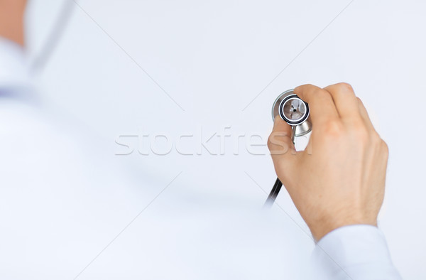 doctor hand with stethoscope listening somebody Stock photo © dolgachov
