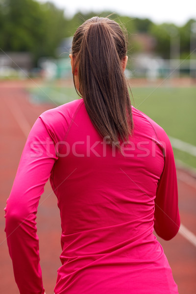 woman running on track outdoors from back Stock photo © dolgachov