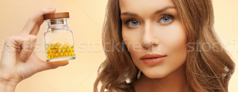 woman with vitamins Stock photo © dolgachov